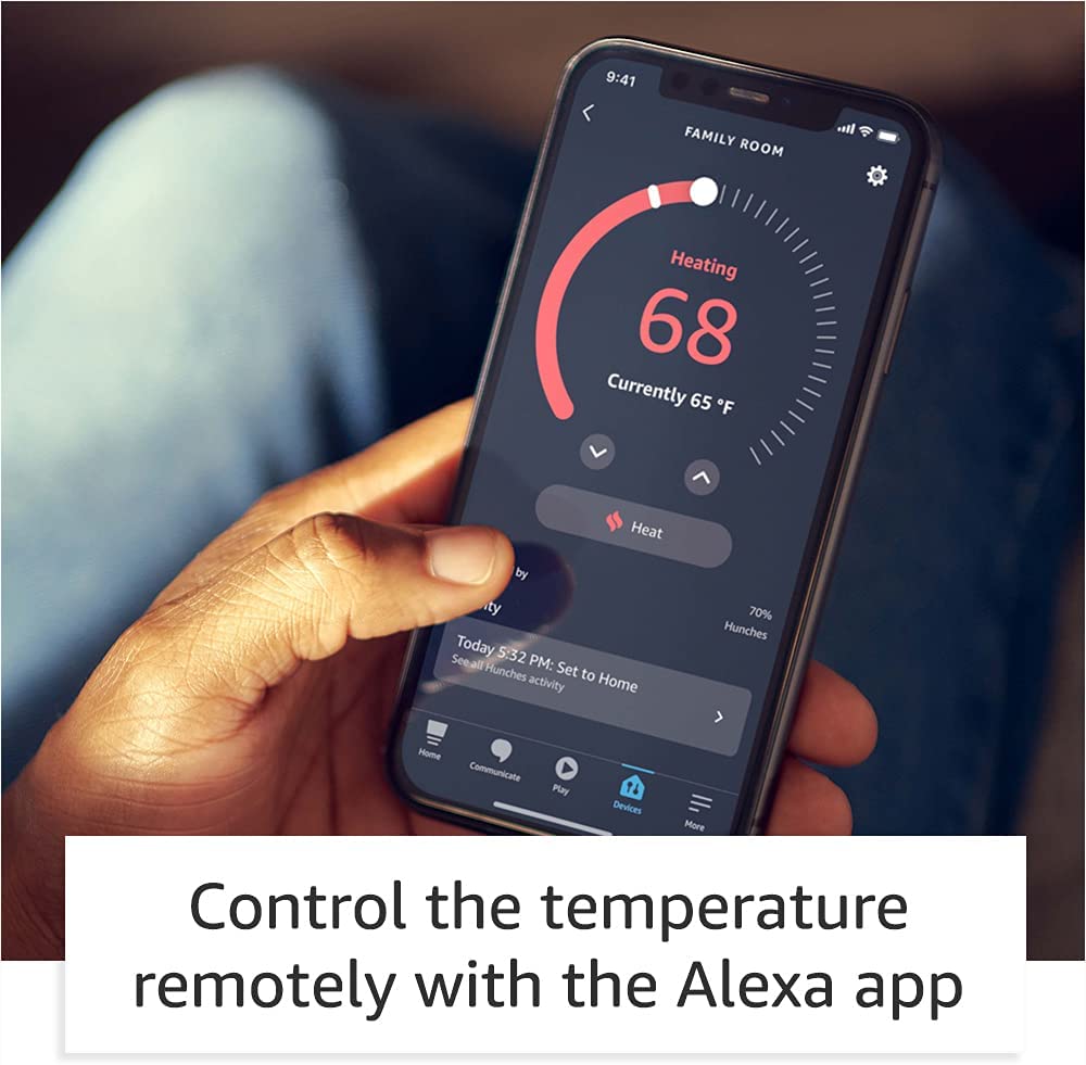 Man holding Amazon Smart Thermostat app