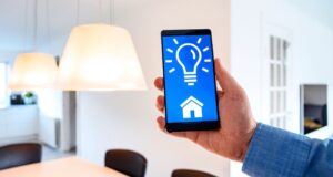 man controlling smart bulbs with apps