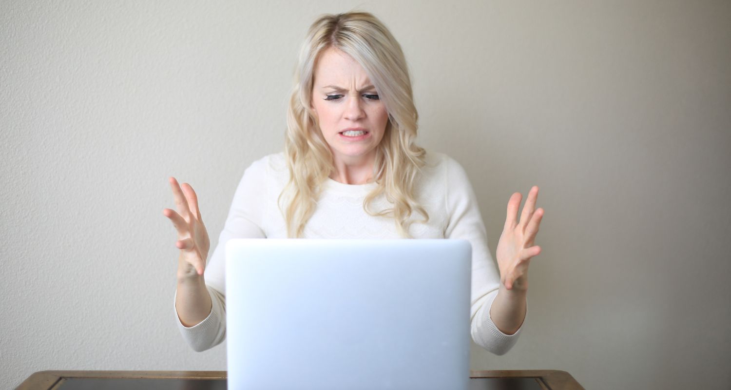 frustrated woman at her slow computer
