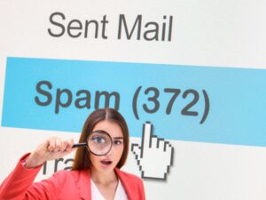 woman looking closer at her spam messages