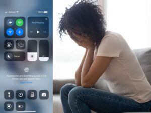 stressed woman next to iPhone control center screen