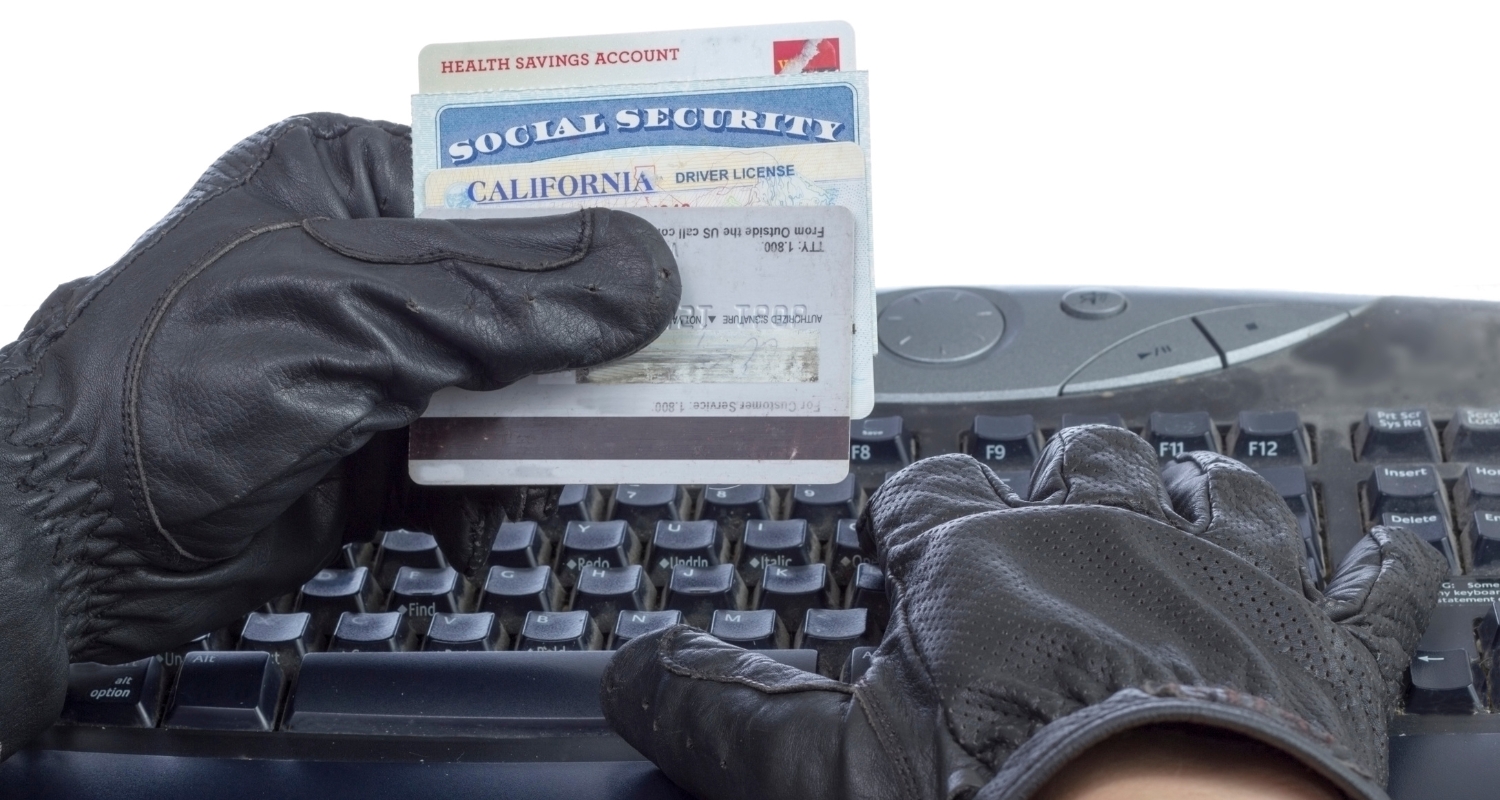 thief stealing social security card