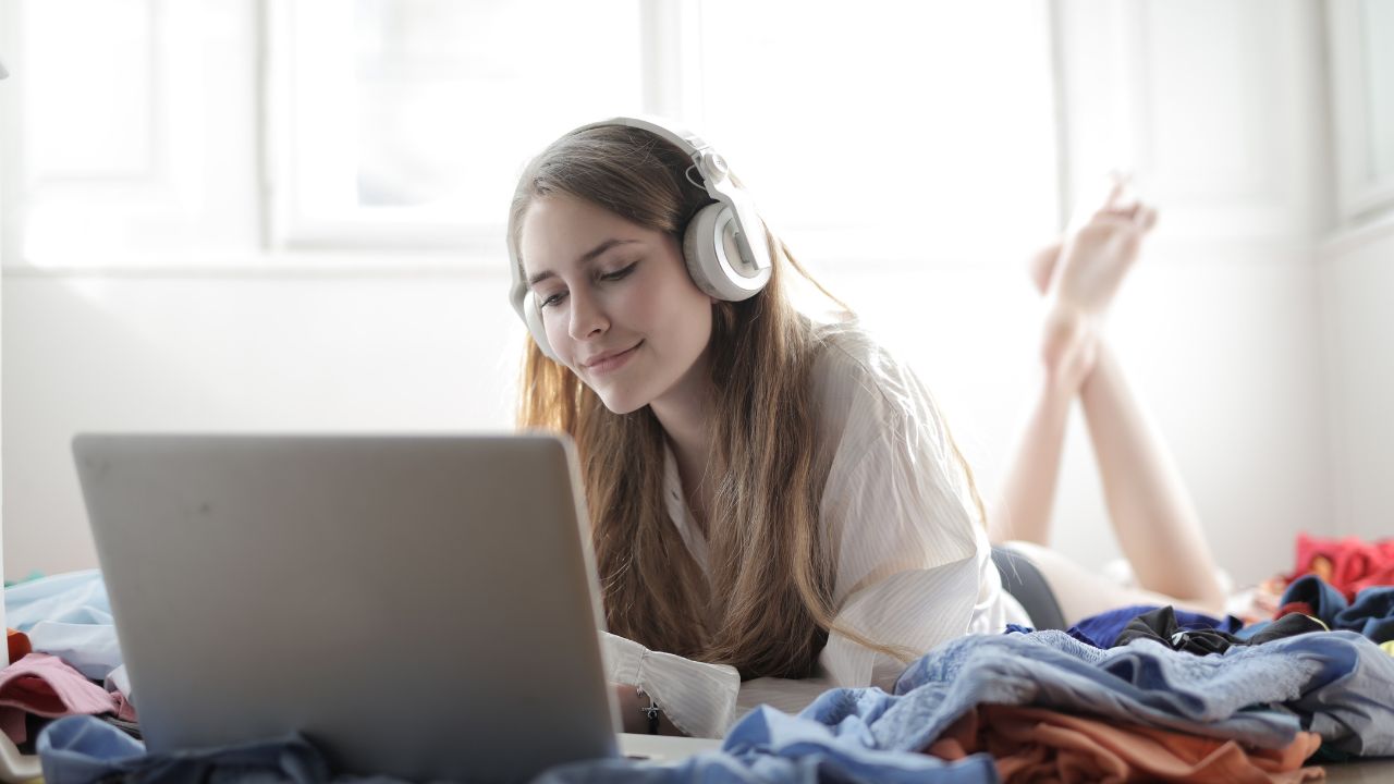 WOMAN LISTENING TO PODCAST