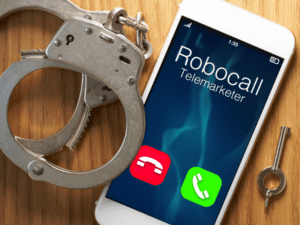 robocall on iphone with handcuffs next to phone