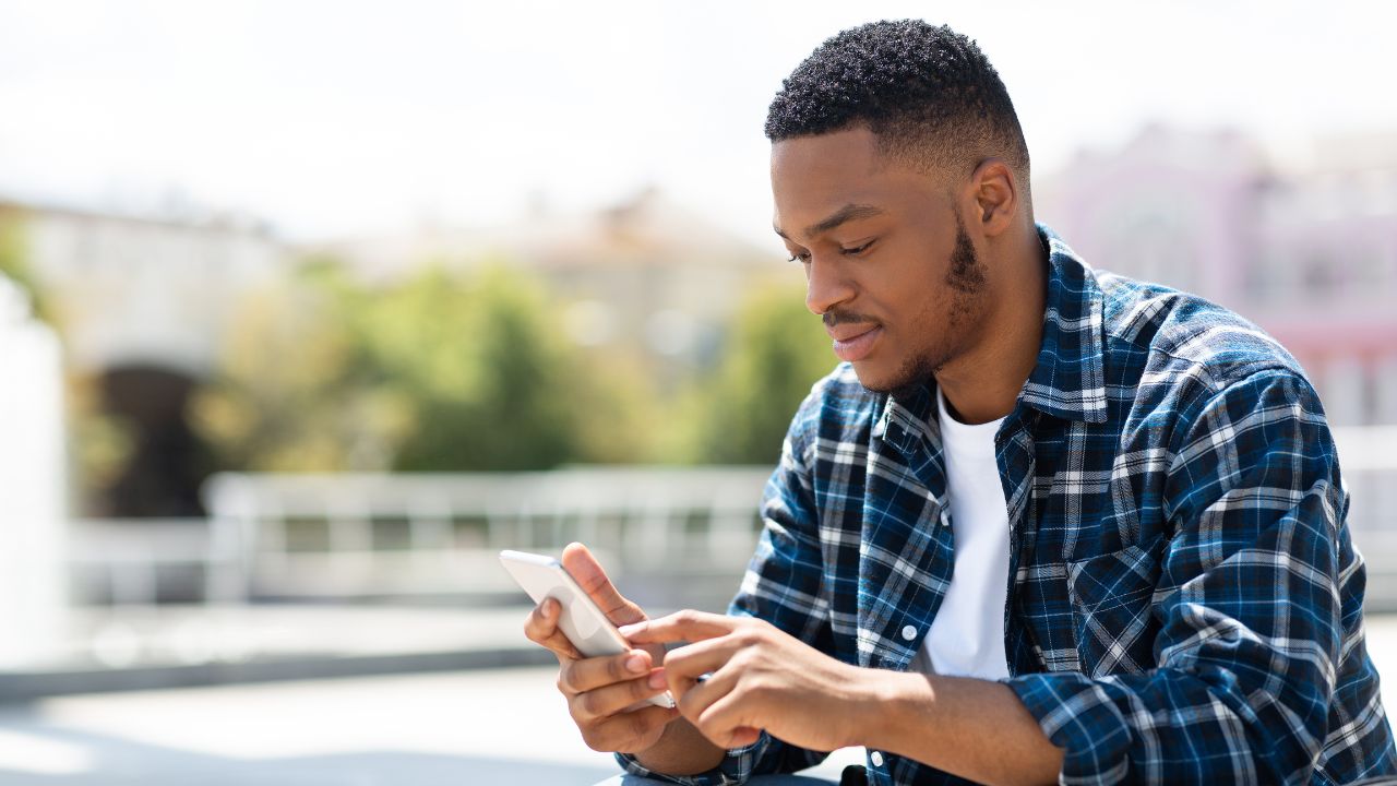 2-GUY LOOKING AT PHONE