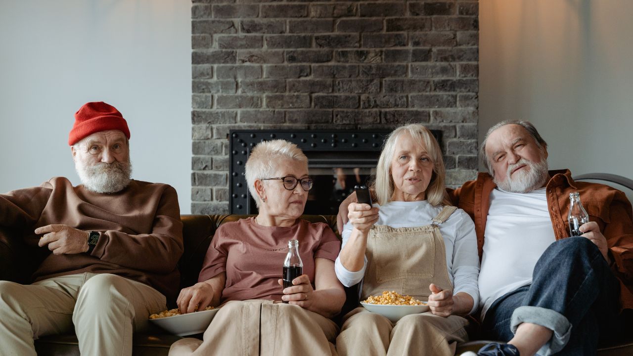 2-older people watching tv
