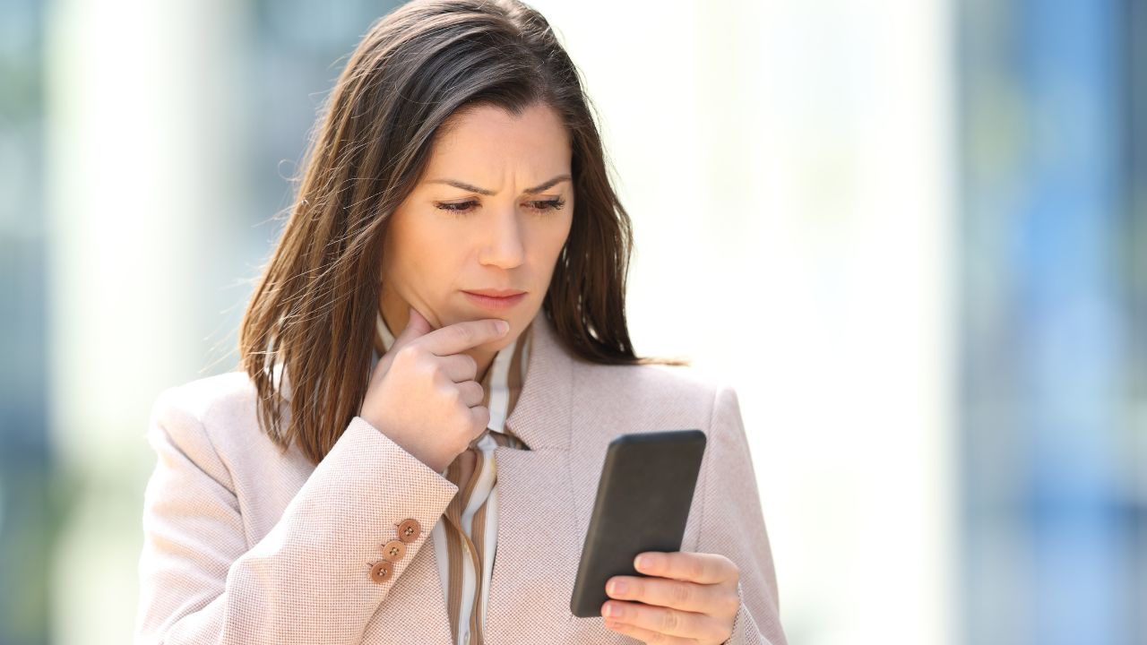 1-woman looking confused at phone
