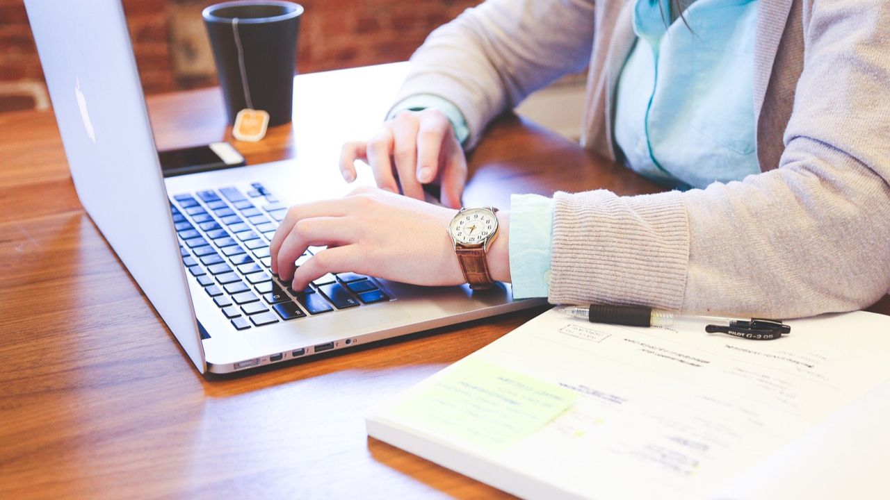 woman on laptop typing 