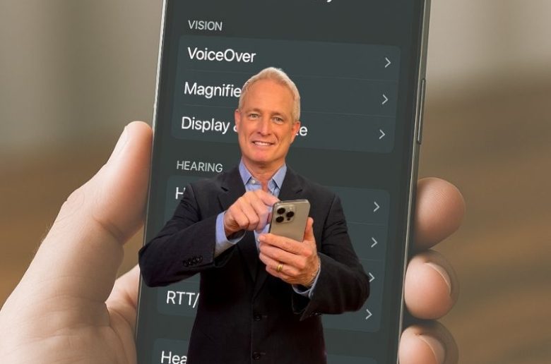 Kurt standing in front of an iPhone with accessibility settings visible