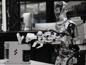 Humanoid robot makes coffee by watching a video