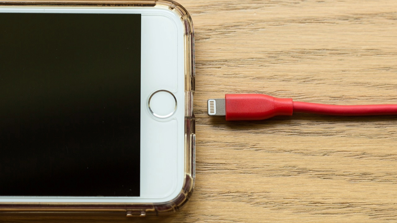A stock photo showing a lightning cable and an iPhone. 