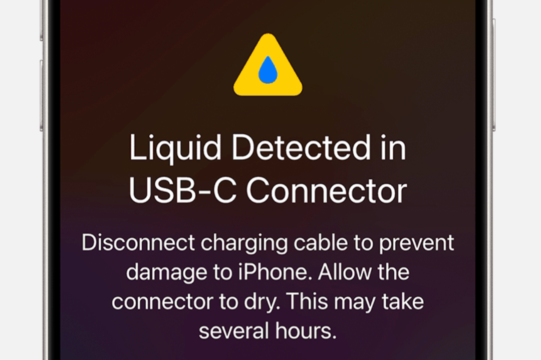 A cropped screenshot showing the 'Liquid Detected...' alert on an iPhone. 