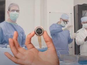 Neuralink device being held in an operating room setting