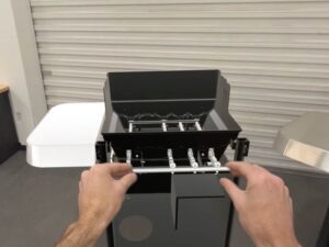 Person using BILT App for Apple Vision Pro to put together a grill