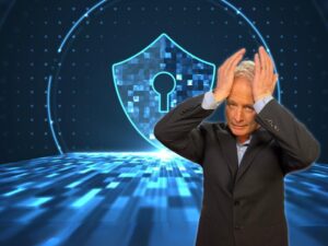 Kurt CyberGuy Knutsson standing in front of cybersecurity shield