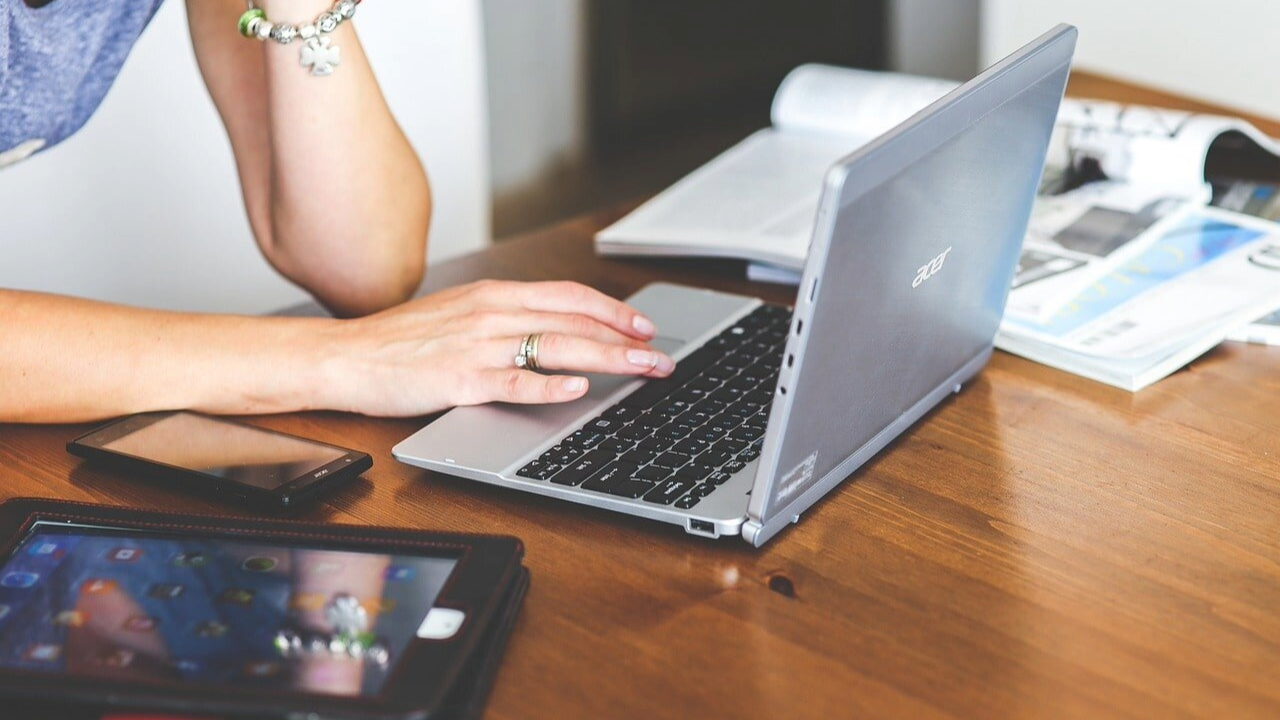 A person typing on a laptop