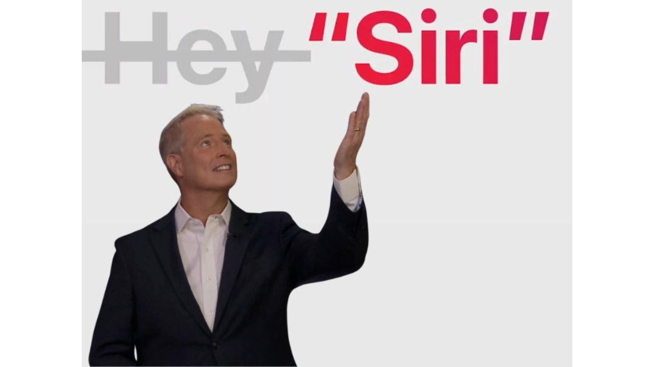 A photograph of Kurt Knutsson holding his hand towards the word "Siri" with the word "Hey" crossed out. 