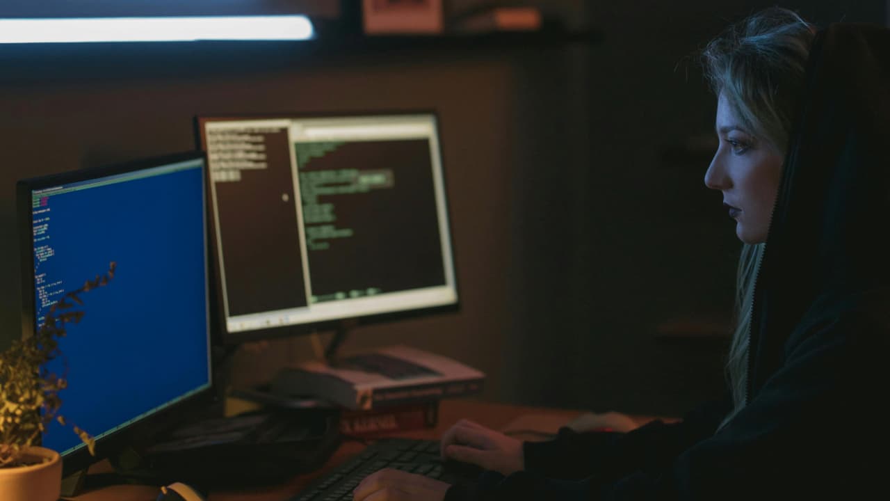 A woman using a computer.