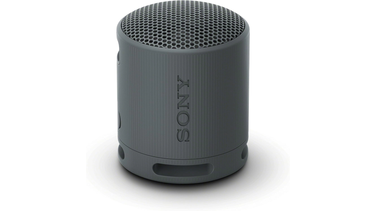 A stock photo from Amazon showing the Sony SRS-XB100 wireless Bluetooth speaker on a white background.