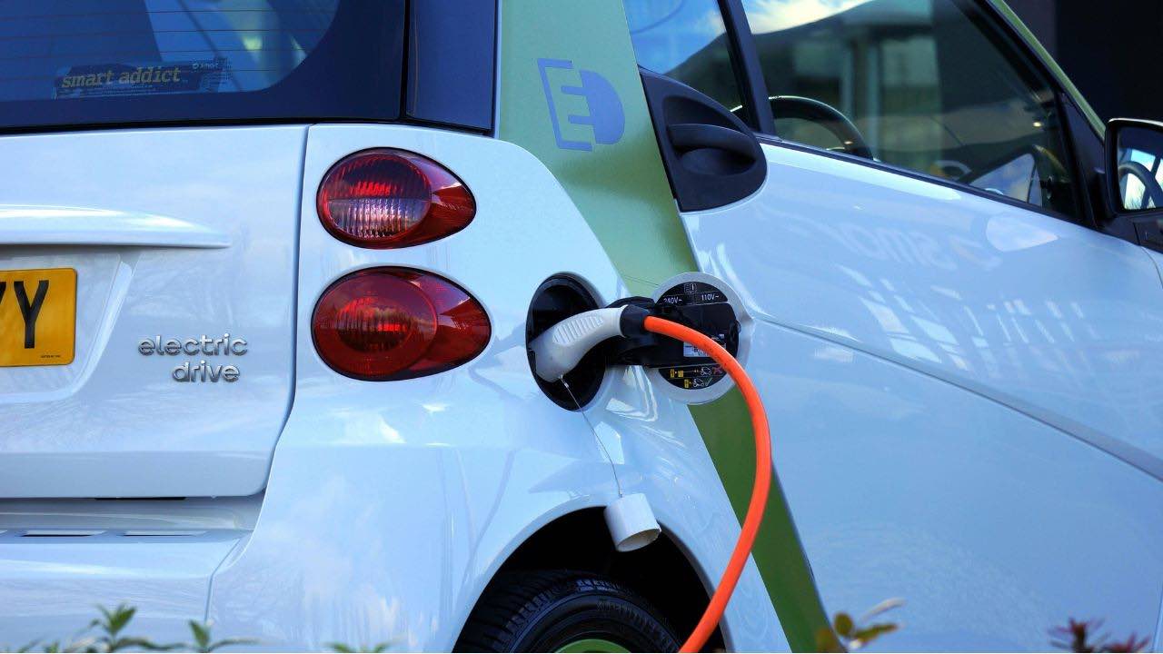 an electric car is plugged into a charging station