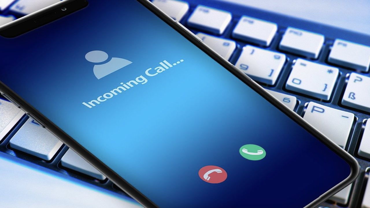 An iPhone with an incoming call on top of a keyword