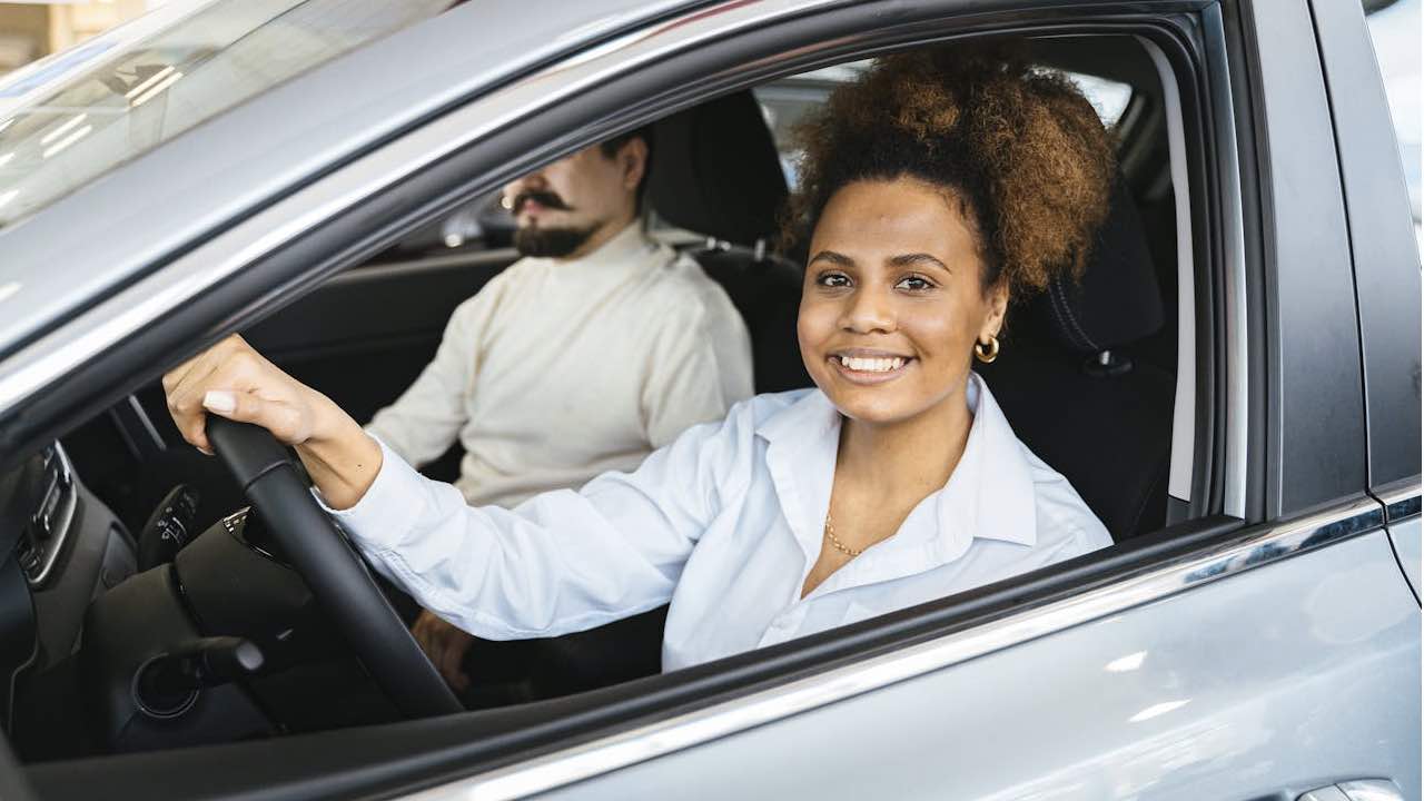 Smiling Woman Sitting Inside the Car