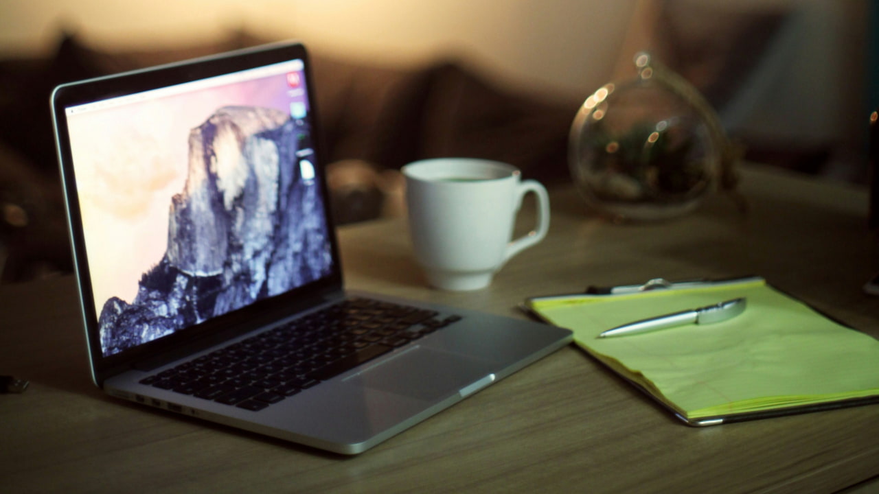 A MacBook kept on a table.