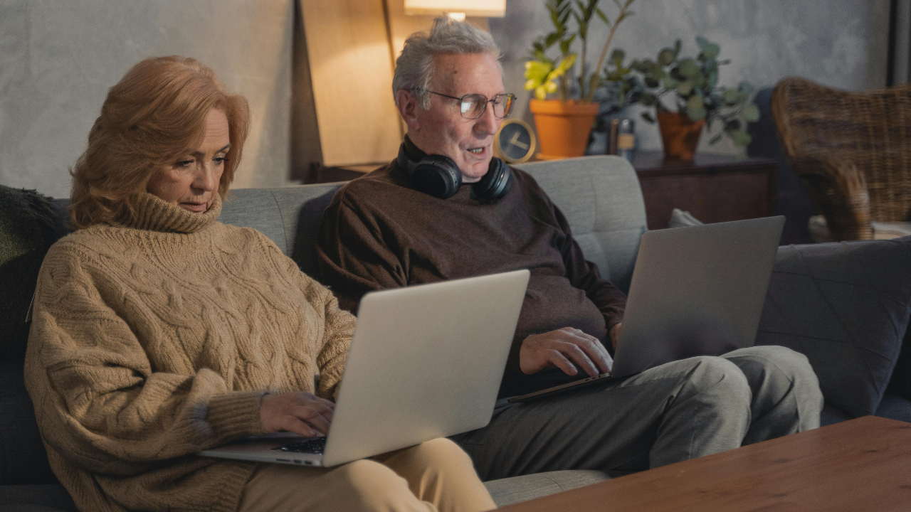 Couple on their laptops 