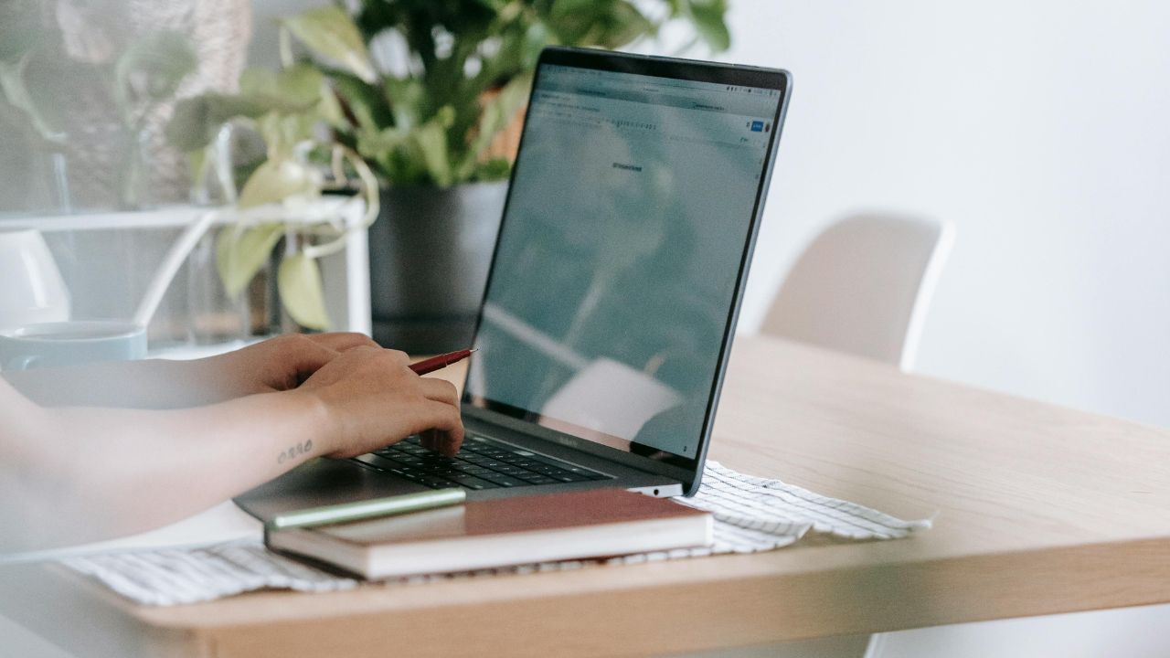 A person typing on a laptop.