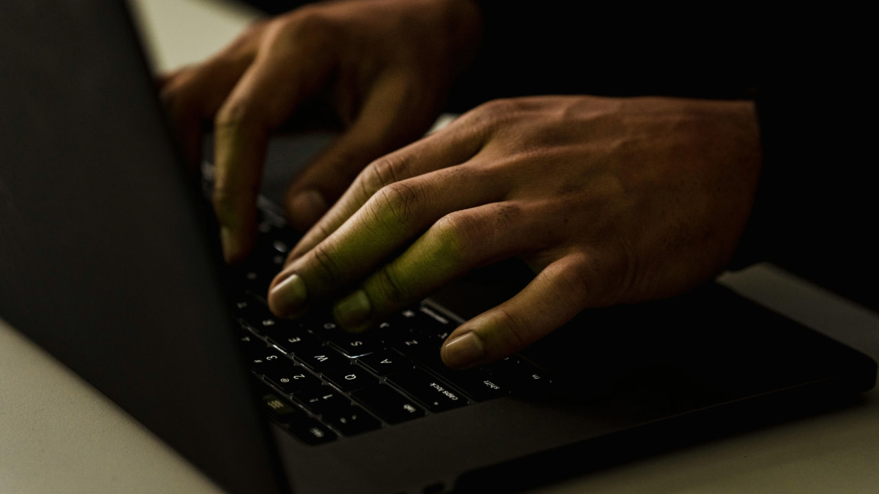 A person typing on a computer.