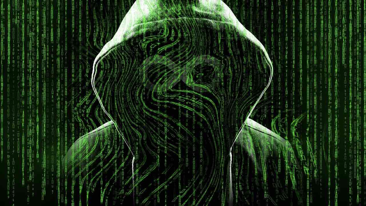 Hooded figure with neon green code covering them