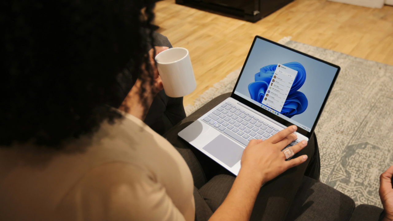 A woman using a laptop.