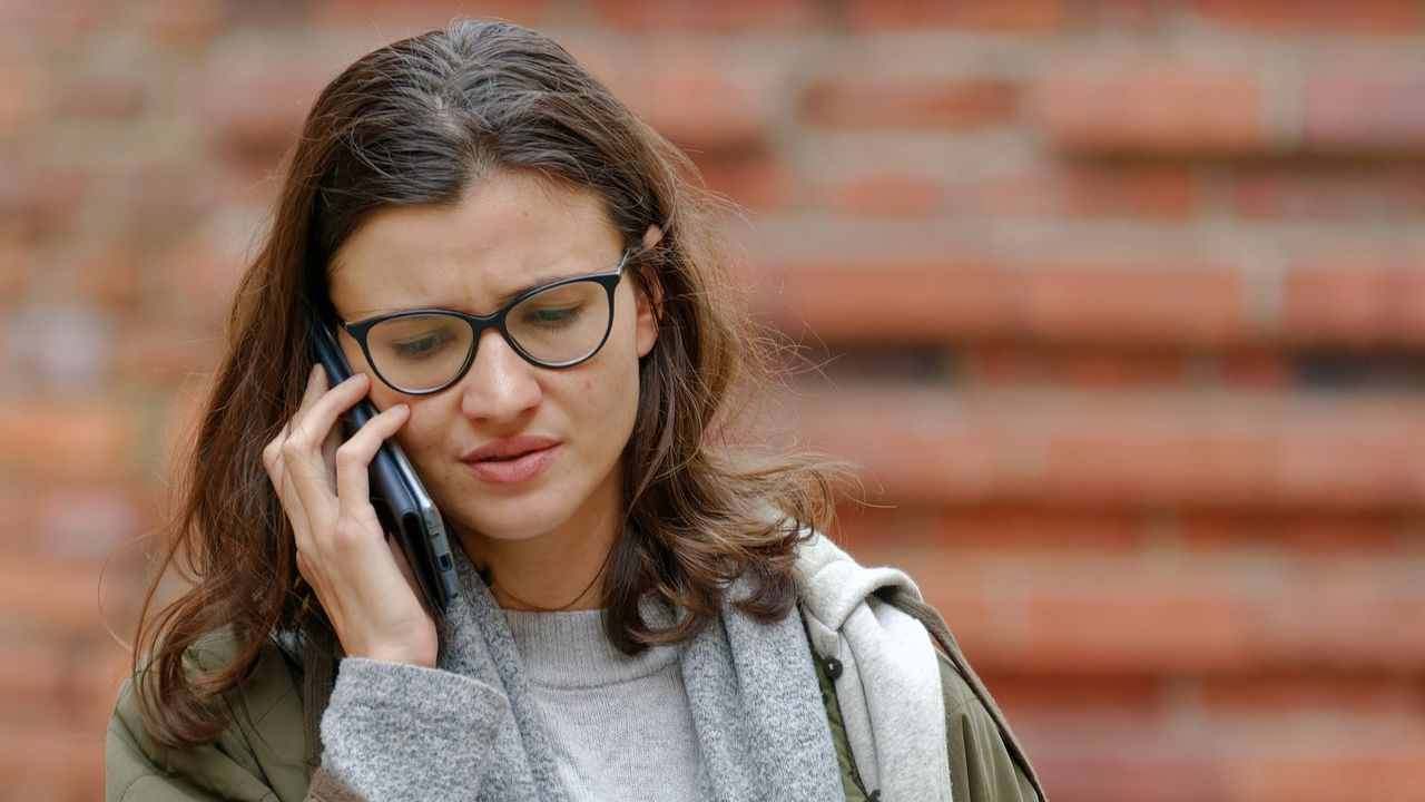 A woman speaking on her cell phone