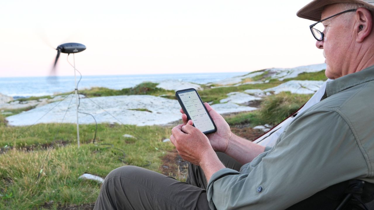 Image of a man using the Shine 2.0 wind turbine 