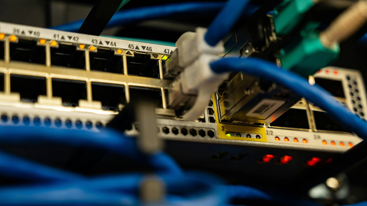 A stock photo showing cables plugged into a router device.