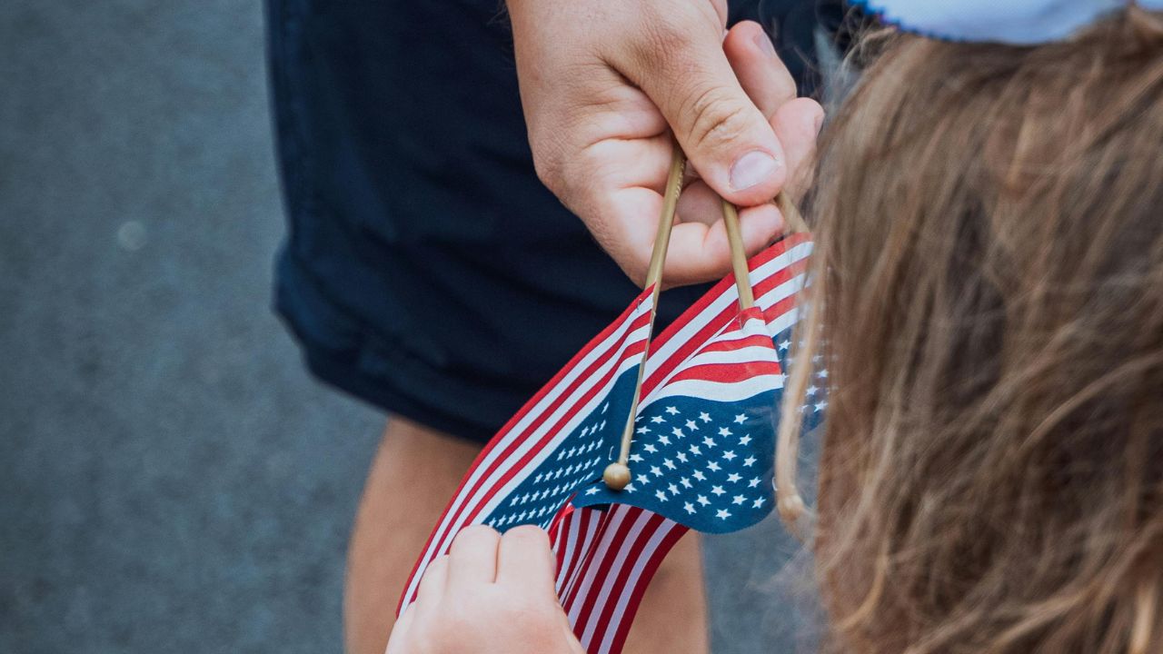 People holding the US flag