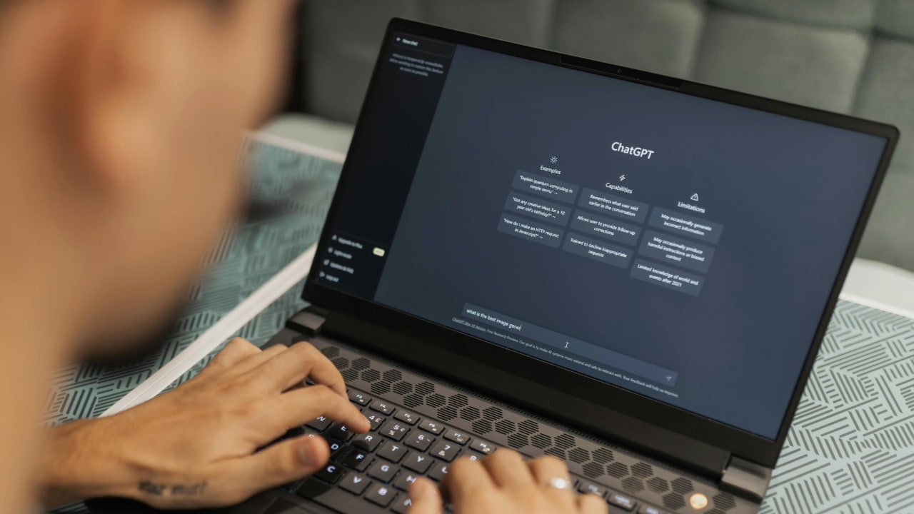 A person using chatgpt on a laptop.
