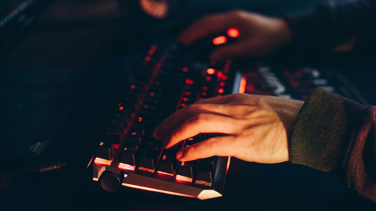 A person typing on laptop keyboard