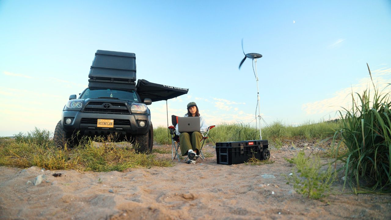 A woman using the Shine 2.0 wind turbine 