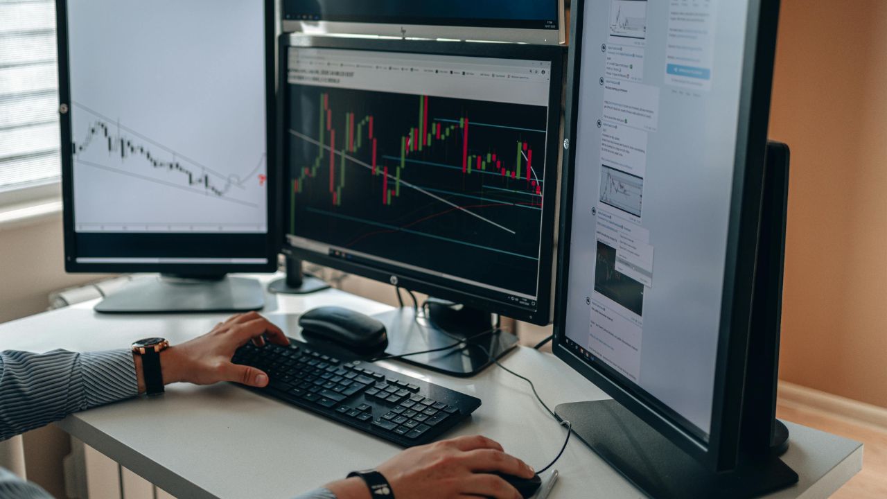 A stock trader working on computers 