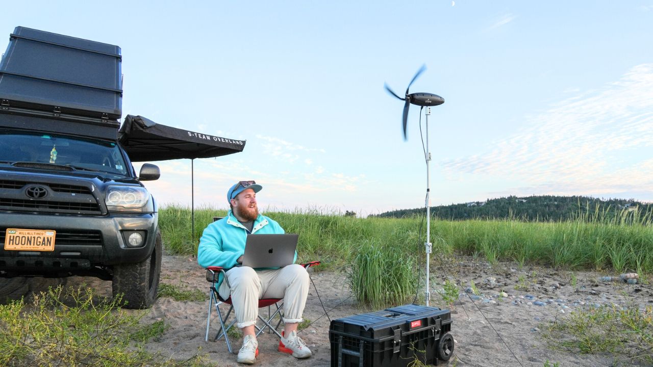 A man using the Shine 2.0 wind turbine 