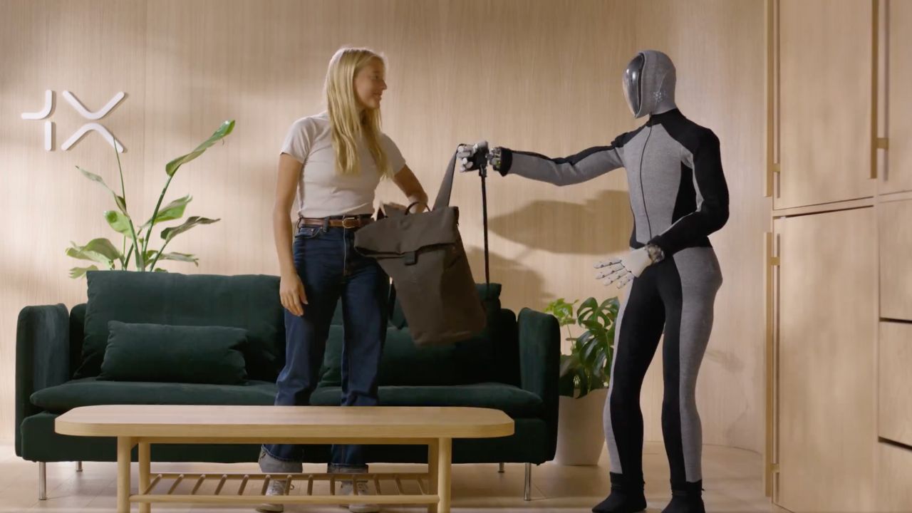 Image of a humanoid robot named Neo and a woman 