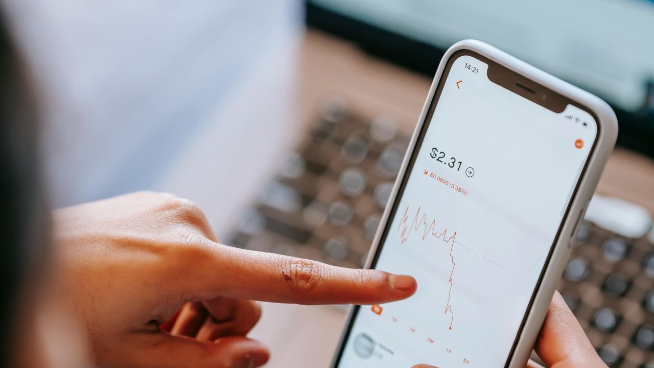 A stock trader at work on her cell phone 