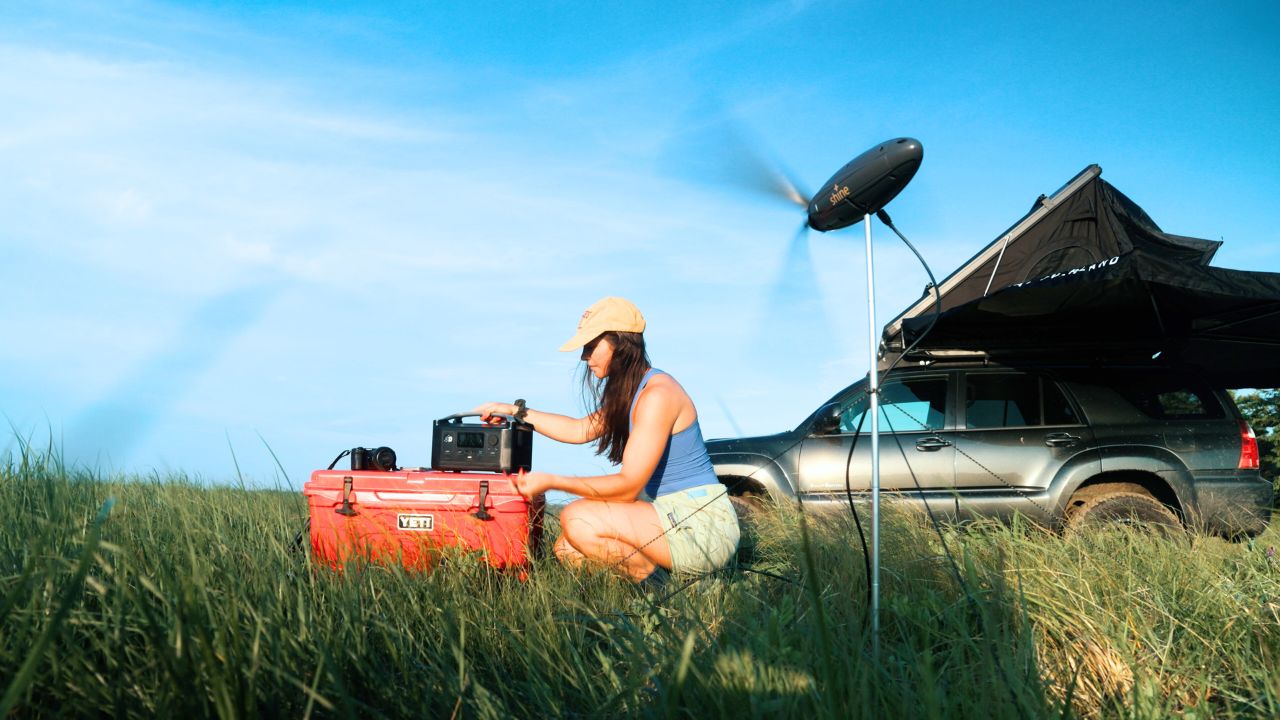 A woman using the Shine 2.0 wind turbine 