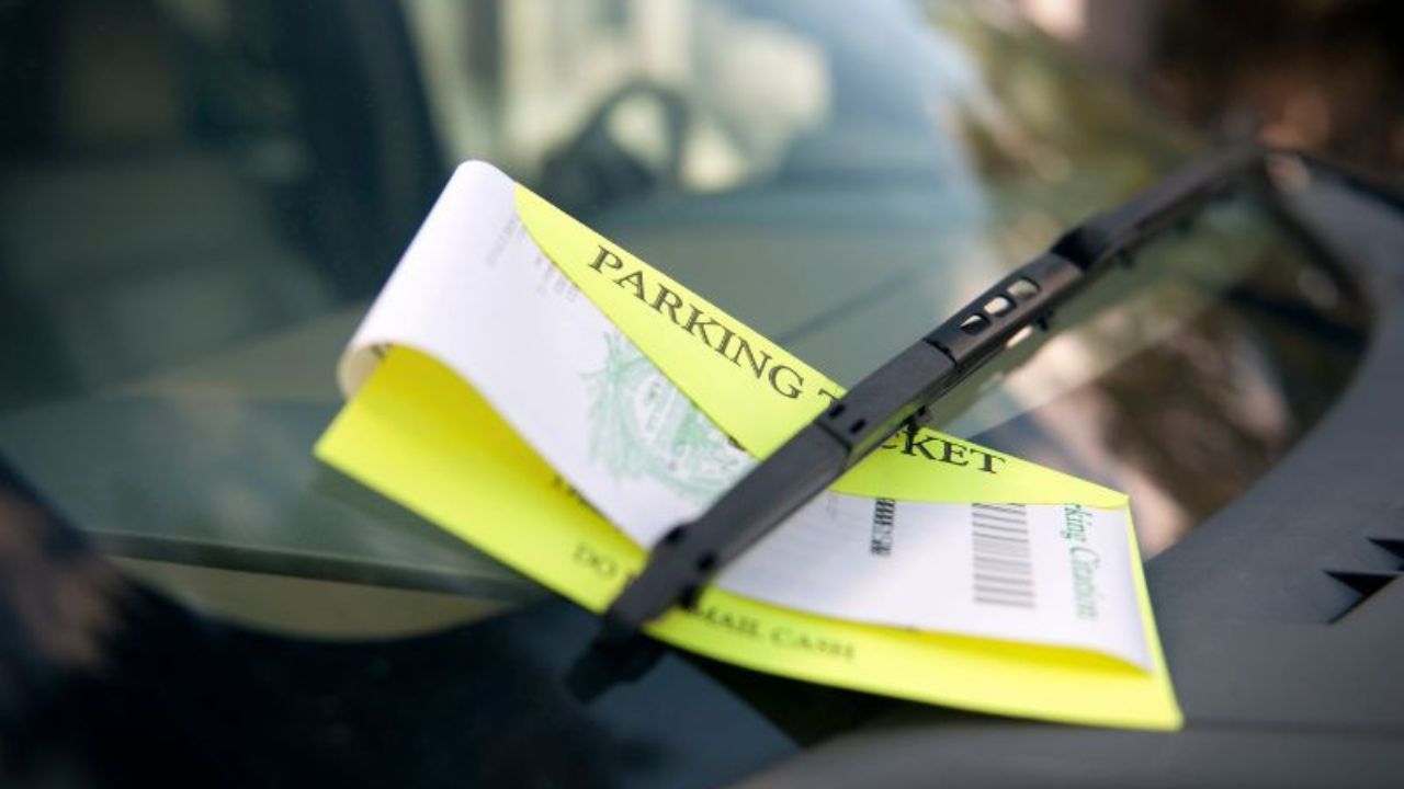 Image of parking ticket on a car windshield 