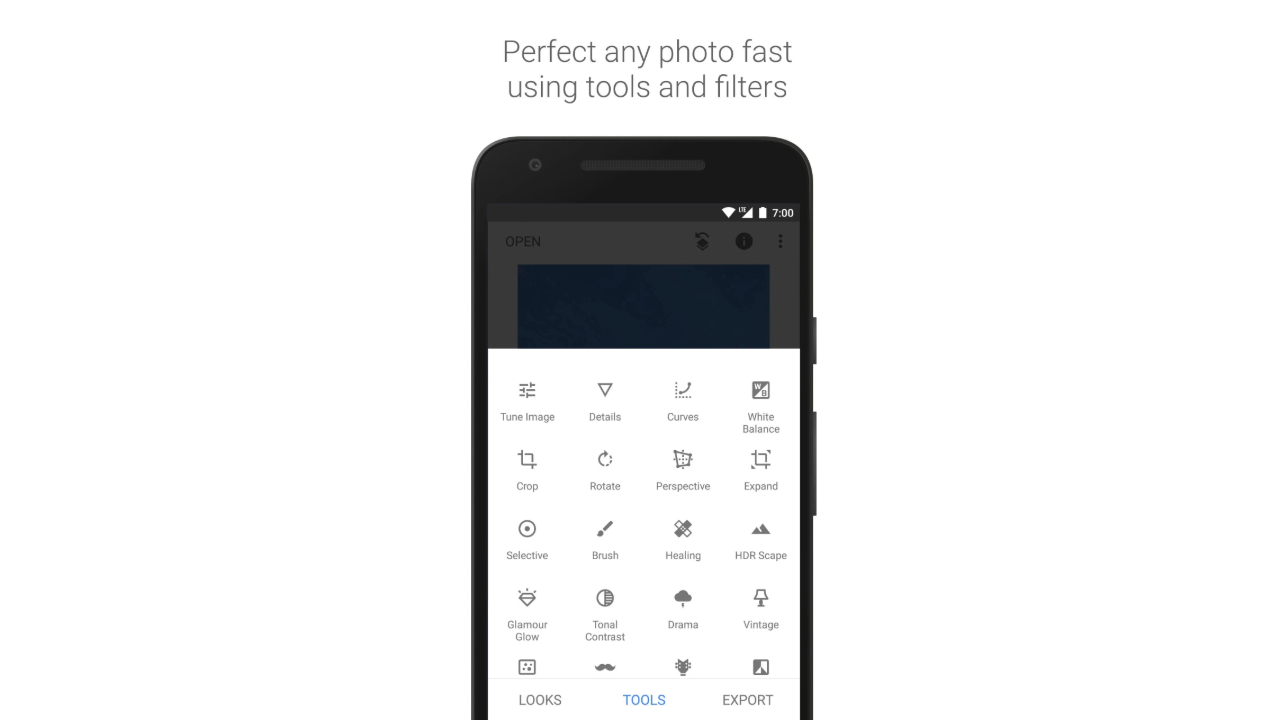 A press kit photo from the Google Play Store showing Snapseed on a smartphone.
