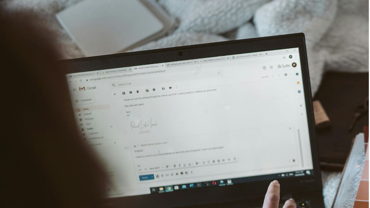 A woman accessing her email on her laptop 