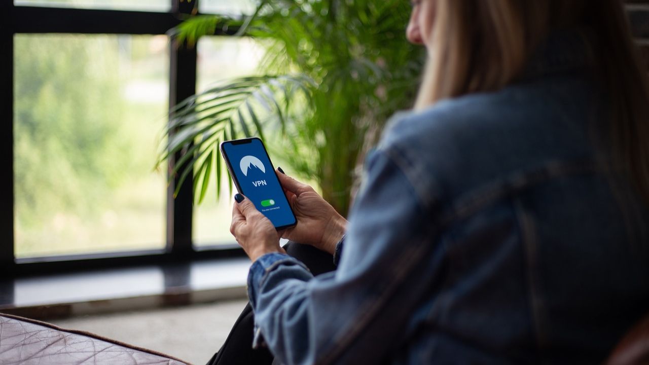 A woman using a VPN on her cell phone 