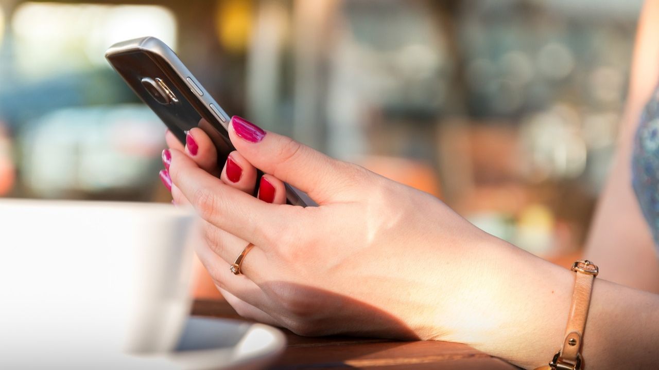 Image of a person texting on her phone 