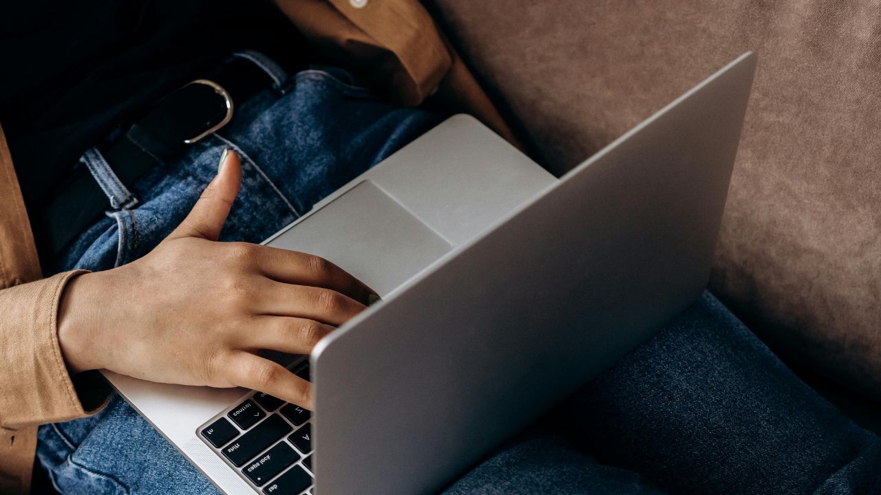 A woman tying on her laptop 